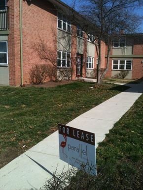 St. Louis apartment for rent - A sign that says For Lease is in front of a brick building.