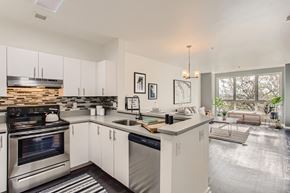 Portland apartment for rent - a kitchen with white cabinets and a counter top