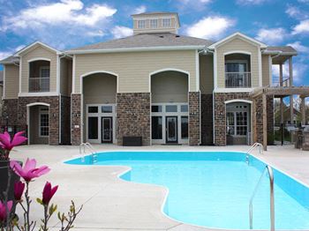Resort-style swimming pool with wraparound sundeck