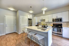 Bellevue apartment for rent - Kitchen with Bar Seating, Hardwood Inspired Floor and Ceiling Lights