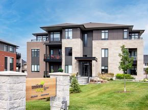 Ottawa apartment for rent - a home with a wooden sign in front of it