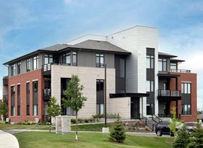 Ottawa apartment for rent - a large building with a car parked in front of it