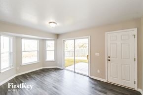 Middleburg house for rent - A room with a white door and a window with a view of a fence.