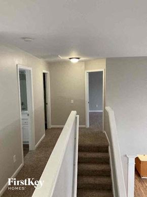 Huntersville house for rent - a hallway with stairs and a light on the ceiling