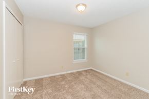 Jacksonville house for rent - a spacious room with carpet and a window