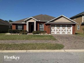 Jacksonville house for rent - A house with a white garage door is for sale.