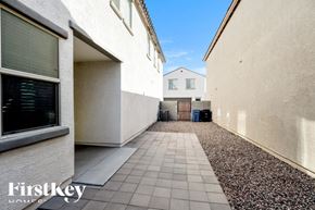 Mesa house for rent - A narrow alley with a tiled walkway separates two buildings.