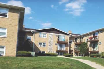 Addison apartment for rent - Apartment building with a clear blue sky above.