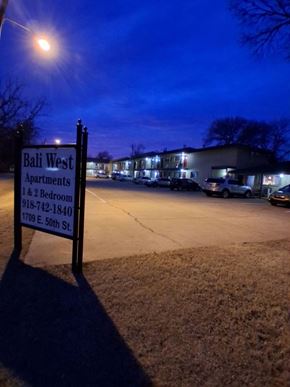 Tulsa apartment for rent - A sign for Bali West Apartments stands in the foreground.