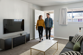 Tulsa apartment for rent - A man and woman are standing in a living room.
