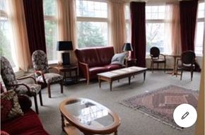Toronto apartment for rent - a living room with a couch and chairs and a table