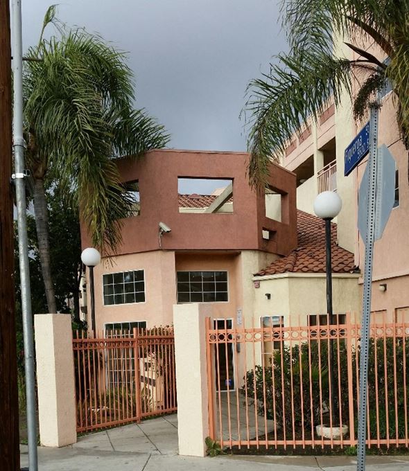 Los Angeles apartment for rent - A brown gate with a lion head on it.