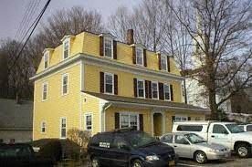 West Boylston apartment for rent - a yellow house with cars parked in front of it