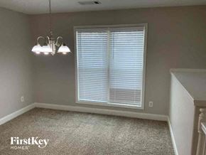 Bethlehem house for rent - an empty dining room with a window and two lights