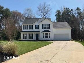 Charlotte house for rent - a white house with a sidewalk in front of it