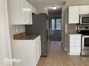 Charlotte house for rent - a kitchen with a stove and a refrigerator