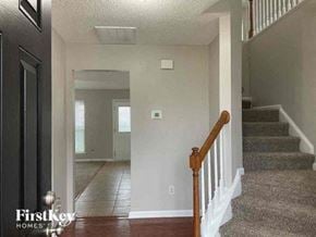 Charlotte house for rent - a house with a staircase and a hallway with a door