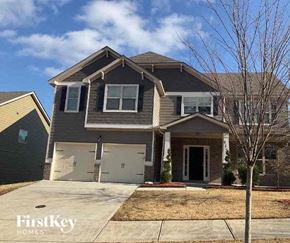 Lithia Springs house for rent - a house with two garage doors on a driveway