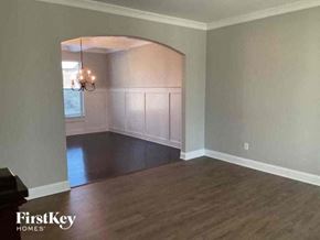 Lithia Springs house for rent - an empty living room with a hard wood floor