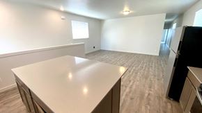 Forest Grove house for rent - an empty kitchen and living room with a white counter top