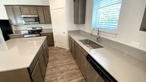 Forest Grove house for rent - an empty kitchen with a sink and counter top