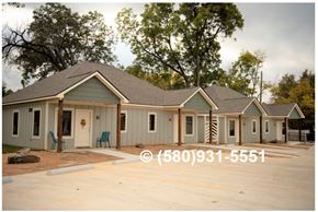 Durant apartment for rent - A row of houses with a phone number (580)931-5551 displayed on the image.