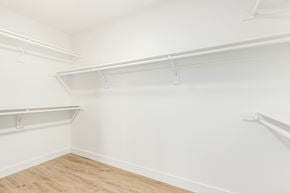 Gilbert house for rent - an empty room with white walls and a wood floor