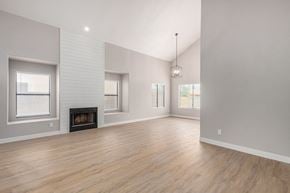Gilbert house for rent - a living room with a fireplace and a hard wood floor