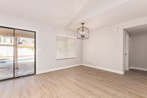 Glendale house for rent - A room with a sliding glass door leading to a pool.