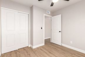 Glendale house for rent - A room with two white doors and a ceiling fan.