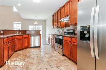 Moncks Corner house for rent - an updated kitchen with stainless steel appliances and wooden cabinets