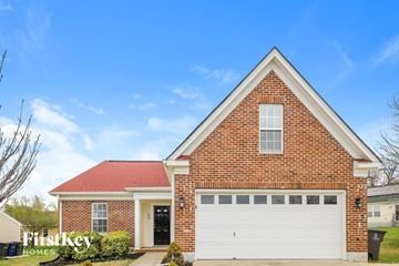 Winston Salem house for rent - a brick house with a white garage door