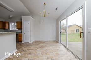 Winston Salem house for rent - a kitchen and living room with a large sliding glass door