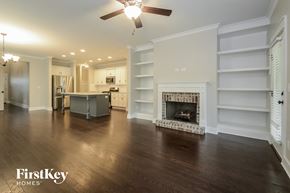 Irondale house for rent - A spacious living room with a fireplace and built-in shelves.