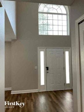 Jacksonville house for rent - a room with a white door and a window