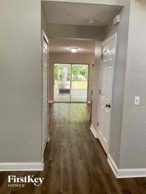 Jacksonville house for rent - a hallway with wood floors and a door to a house