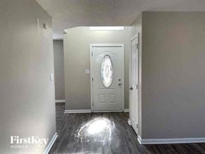 Charlotte house for rent - an empty room with a white door and a window
