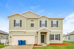 Jacksonville house for rent - a beige house with a blue sky in the background