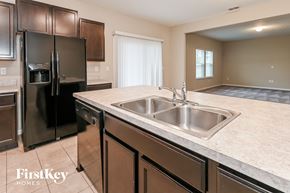 Jacksonville house for rent - a kitchen with stainless steel appliances and a large counter with a sink
