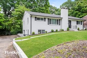 Winston Salem house for rent - a white house with a yard and a sidewalk