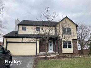 Reynoldsburg house for rent - a brick house with a white garage door