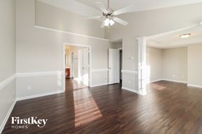 Lexington house for rent - a living room with hardwood flooring and a ceiling fan