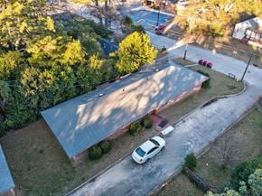 Macon apartment for rent - A car is parked in a driveway in front of a house.