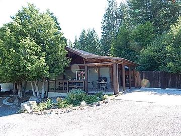 Coeur D Alene house for rent - a small cabin with a patio and trees