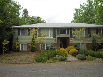Coeur D' Alene house for rent - a house with a front porch and a driveway