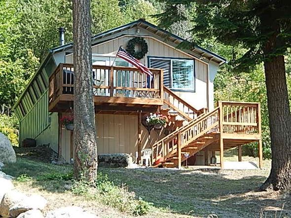 Bayview house for rent - a house with a deck and a flag on the balcony