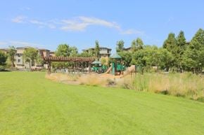 San Jose house for rent - a large grass field with a playground in the background