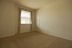 San Jose house for rent - an empty living room with a window and a door
