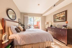 San Jose house for rent - a bedroom with a bed and a dresser and a window