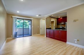 San Jose house for rent - A spacious living room with a sliding glass door leading to a balcony.